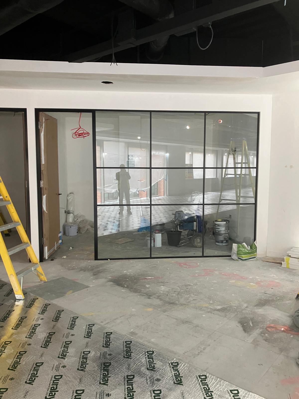 Crittall-style glass partition wall installed